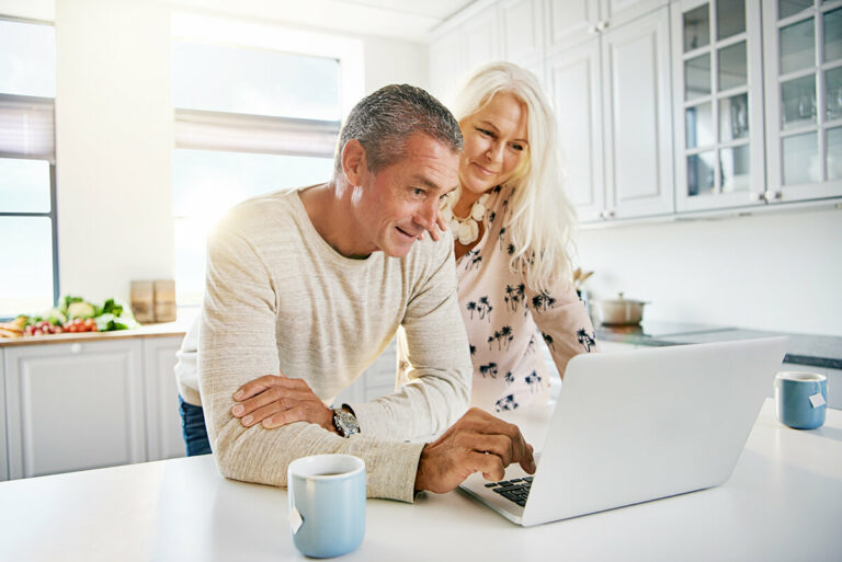 couple speaking with sarasota financial advisors